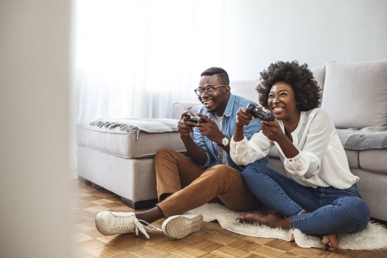 Couple plays video games at home.Valentine's Date Tips!
