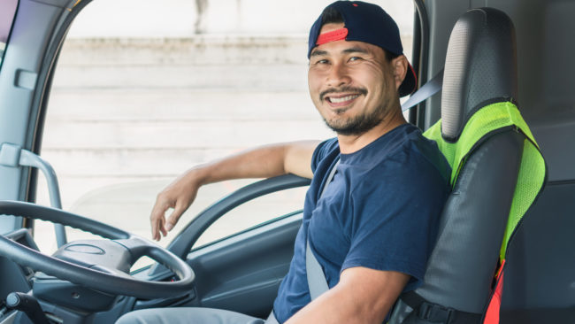 The Smile Of A Professional Truck Driver In A Long Transportation Hiring a truck driver in Los Angeles