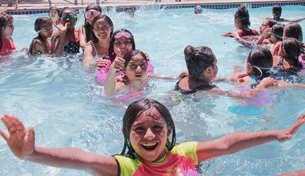 children swimming in the pool at Circle V Camp